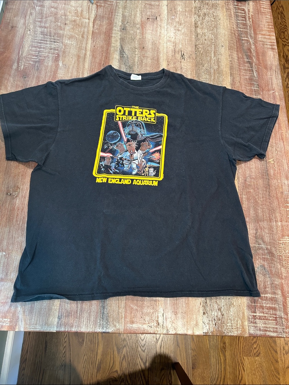 VTG Delta Cotton ‘The Otters Strike Back' Black Graphic Tee